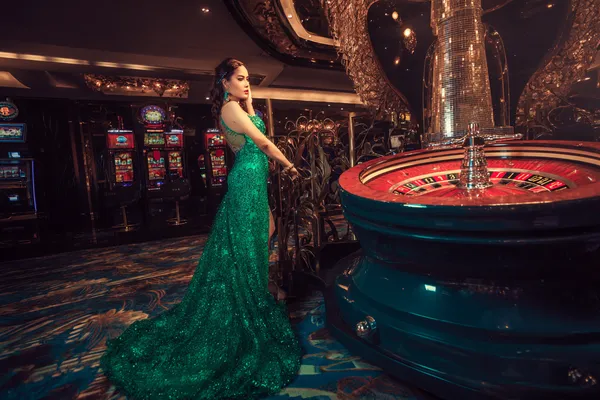 A dramatic shot of winning sevens landing on a slot reel surrounded by shining gold coins, symbolizing big wins.